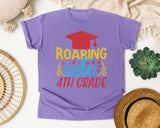 Roaring Into 4th Grade White 2 3 graphic tee in Violet
