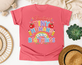 Teaching Tiny Humans To Do Big Things graphic tee in Watermelon