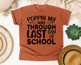 Poppin My Way Through Last Day Of School White graphic tee in Yam