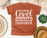 4th Grade Level Unlocked White graphic tee in Yam