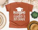 Roaring Into 1st Grade White 2 graphic tee in Yam
