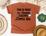 This Is What An Awesome Teacher Looks Like graphic tee in Yam
