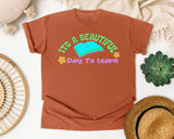 It's A Beautiful Day To Learn graphic tee in Yam