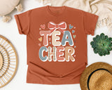 Teacher Bow Striped Graphic Tee graphic tee in Yam