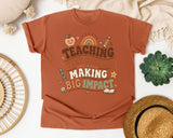 Teaching Tiny Humans Making Big Impact graphic tee in Yam