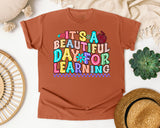 Its A Beautiful Day For Learning graphic tee in Yam
