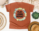 Play Learn Repeat graphic tee in Yam