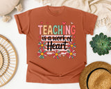Teaching Is A Work Of Heart Daisies graphic tee in Yam
