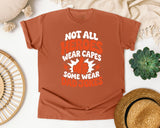 Not All Heroes Wear Capes Some Wear Dad Jokes Orange 2 graphic tee in Yam