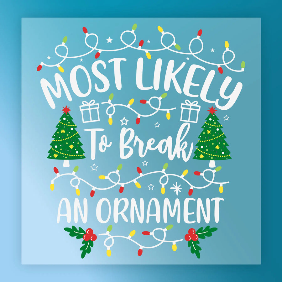 InkMerge’s "Most Likely To Break An Ornament" design features white text on blue, festive lights, trees, gifts, stars & holly—ideal for custom apparel or precut transfers this holiday season.
