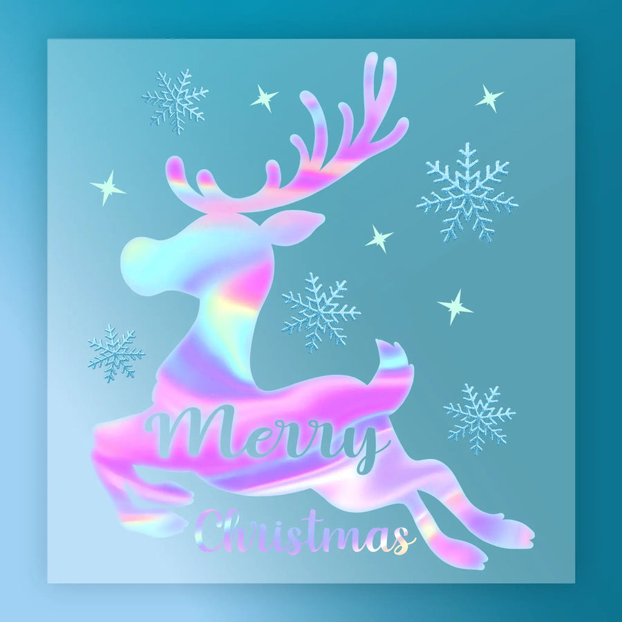 The InkMerge Merry Christmas Holographic Reindeer Design features a shimmering reindeer with antlers, pastel "Merry Christmas" text, snowflakes, and stars on a blue background—ideal for ugly sweater parties or festive DTF transfers.