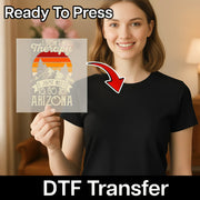 A smiling woman in a black shirt holds an InkMerge DTF transfer sheet with the "Thankful For My Family Retro Design." Perfect for Thanksgiving heat press projects! Text above reads Ready To Press and below, DTF Transfer.