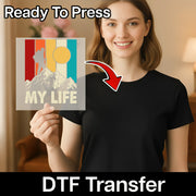 A smiling woman in a black shirt holds a colorful InkMerge Retro Vertical Stripes Design Direct-to-Film transfer. Text reads "precut ready to press" and "DTF Transfer.