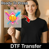 A woman holding a sign with a baseball graphic and a red arrow pointing to it, with the text "Ready To Press" and "DTF Transfer" below the image.