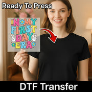 A woman holding a colorful sign with the text "N MY FIRST DAY ERA" on it, smiling and posing for the camera.