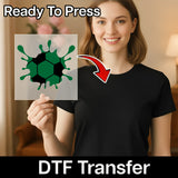 A woman is holding up a transparent sheet with a green and black soccer ball design on it, with a red arrow pointing to her chest.