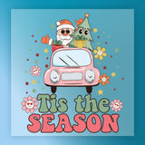 Cartoon Santa and a Christmas tree with gifts ride in a pink car decorated with flowers, stars, and dots. Large “Tis the SEASON” text on blue makes InkMerge’s Holiday Shirt Design perfect for custom apparel or festive DTF heat press transfers!.