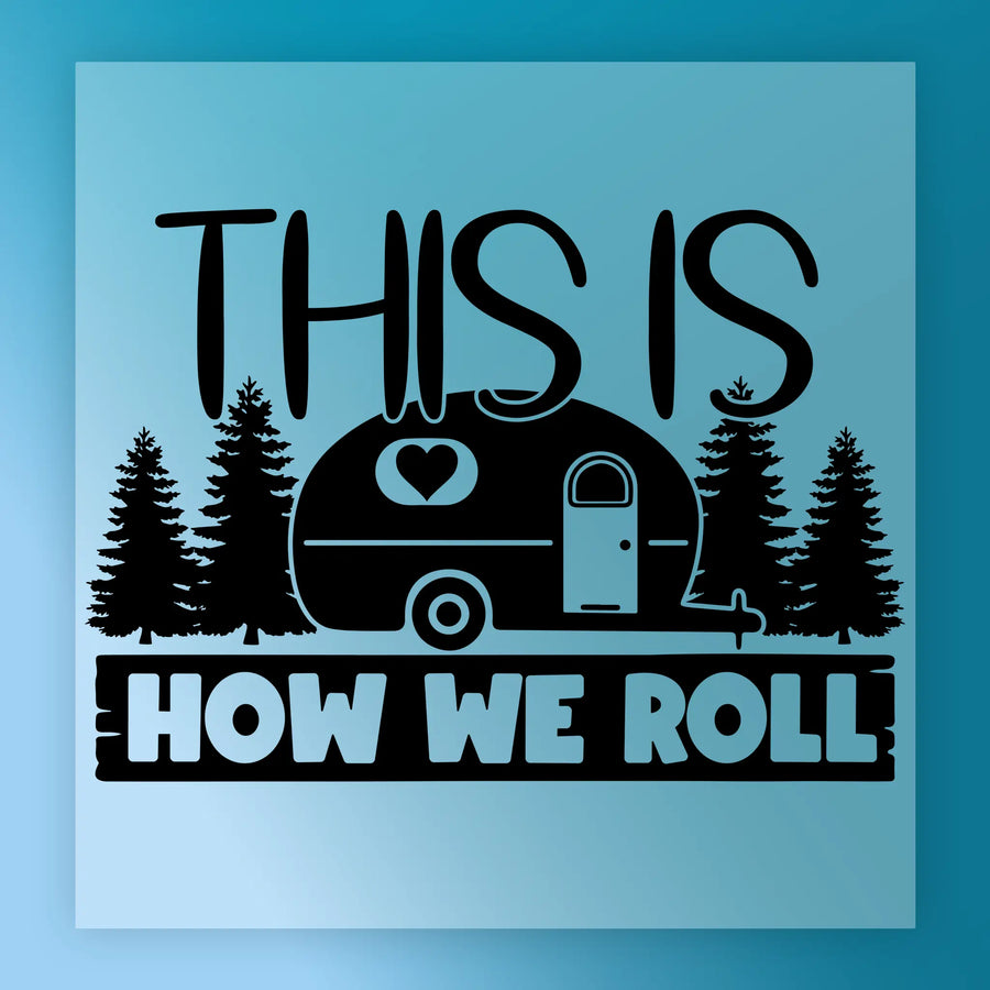 The InkMerge "This Is How We Roll Camper Design - Heat Press Ready" features the phrase above and below a cute camper with heart, pine trees, and a blue background—ideal for your next heat press or DTF transfer project.