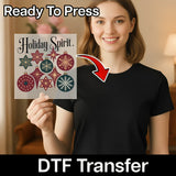 A smiling woman in a black shirt holds an InkMerge Holiday Spirit Vintage Ornaments DTF transfer sheet. An arrow points to her shirt, with text: "Ready To Press, DTF Transfer—ideal for creating custom apparel.