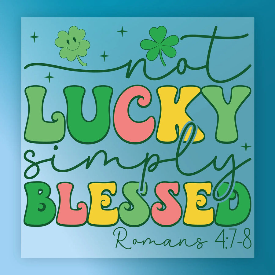 a colorful and whimsical design with the text "not LUCKY simply BLESSED" and a cloverleaf symbol.