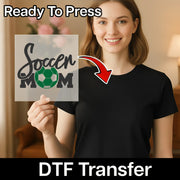 A woman holding a sign with the text "Soccer Mom" and a red arrow pointing to her chest.