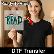 A woman in a black shirt holds the InkMerge "READ Banned Books Retro" DTF transfer, featuring a festive hat, stars, and vintage style. The image displays "Ready To Press" and "DTF Transfer" text with a red arrow highlighting the design.