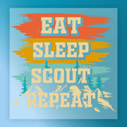 Text graphic with vibrant orange, yellow, and blue brushstrokes reads Eat Sleep Camp Adventure by InkMerge over trees and mountains—ideal for custom apparel or screen printing projects.