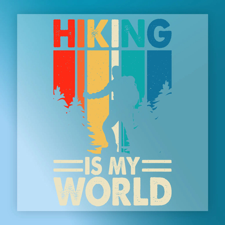 A retro cat silhouette stands before trees and colorful vertical stripes, ideal for heat press transfer. Above and below, the text reads: Hiking is my world. Product: Retro Cat Silhouette Rainbow Design by InkMerge.