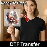 A smiling woman in a black shirt displays the InkMerge “Traditional Santa Claus with Christmas Tree” DTF Transfer, with “Ready To Press” above and a red arrow highlighting the festive heat press graphic on her shirt.