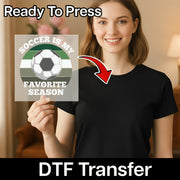 A woman is holding up a sign with the text "Soccer is my favorite season" and a graphic of a soccer ball.