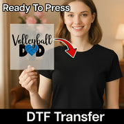 A smiling woman holding a sign with the text "Volleyball Dad" on it, with a red arrow pointing to the sign.