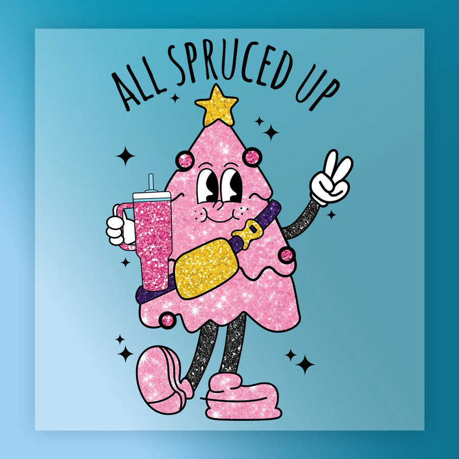 The InkMerge All Spruced Up Glittery Tree features a sparkly pink cartoon Christmas tree with a star, holding a drink and peace sign, wearing shoes and sash. "ALL SPRUCED UP" appears above on a blue background with black star accents.