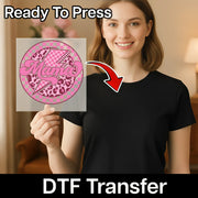 A woman holding a sign with a pink and black design, and there is a text overlay that says "Ready To Press" and "DTF Transfer".