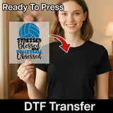 A woman is holding up a sign with a volleyball graphic and text that says "Stressed, Blessed and Volleyball Obsessed".