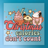 The InkMerge Christmas Calories Don't Count design features a cupcake, gingerbread house, and reindeer mug with stars and candy canes—perfect for DTF transfers or holiday heat press projects.