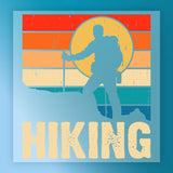 A hiker silhouette with backpack and stick stands on a mountain before a retro sunset of red, orange, yellow, and blue stripes. Ideal for heat press transfer or InkMerge Retro Surfing Sunset DTF projects. Large text below reads HIKING.