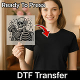 A woman holding a stencil with a skeleton design on it, and there is a red arrow pointing to her chest.