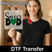 A smiling woman holding a sign with the text "Soccer Dad" on it, with a red arrow pointing to the sign.