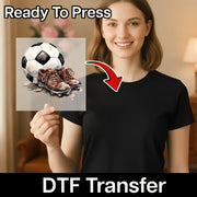A woman holding a transparent sheet with a soccer ball and cleats on it, and there is a red arrow pointing to the sheet.