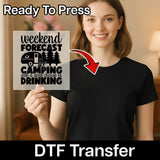 A woman smiles holding an InkMerge Weekend Forecast Camping With Drinking DTF transfer sheet, featuring a camper and trees. Above her: Ready To Press for your heat press projects.