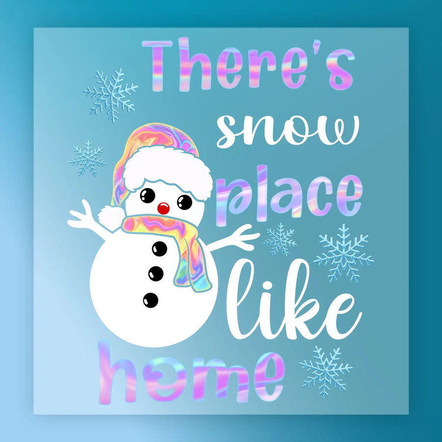 InkMerge's "There's No Place Like Home Snowman Design" features a cheerful snowman in a colorful hat and scarf, surrounded by snowflakes and playful text—perfect for your next DTF transfer or heat press project.