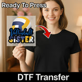 A smiling woman holding up a sign with the text "Volleyball Sister" on it.