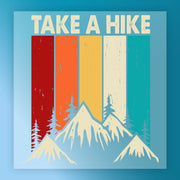a mountain range with pine trees and a vintage-style design.