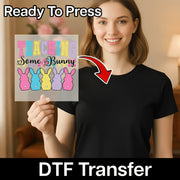 A woman is holding up a sign with the text "Teaching Some Bunny" and there is a red arrow pointing to the sign.