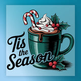 The "Tis the Season Cocoa Design" by InkMerge features a green mug of hot chocolate with whipped cream, two candy canes, and holly on a blue background—ideal for heat press or DTF transfer on premium DTF film.