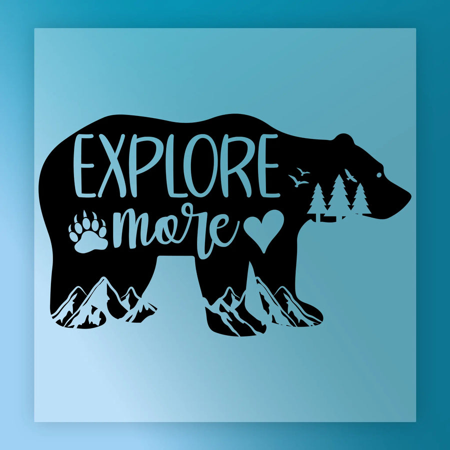 The Explore More Bear Adventure Design by InkMerge features a black bear silhouette with "Explore more," mountains, trees, birds, a paw print, and a heart on a light blue background—perfect for DTF transfer or heat press projects.