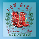 Illustration of red cowboy boots with a bow, Christmas lights, greenery, and snowflakes surrounded by green leaves. Text: "Making Spirits Bright." InkMerge Making Spirits Bright Cowboy Boots—perfect transfer for your heat press projects!.
