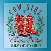 Illustration of red cowboy boots with a bow, Christmas lights, greenery, and snowflakes surrounded by green leaves. Text: "Making Spirits Bright." InkMerge Making Spirits Bright Cowboy Boots—perfect transfer for your heat press projects!.