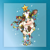 The InkMerge Funny Christmas Cow In Lights - Heat Press Ready features a cow standing on snow, wrapped in colorful bulbs with a yellow star on its head. Ideal for custom apparel with its blue background and festive falling snowflakes design.