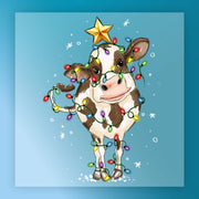 The InkMerge Funny Christmas Cow In Lights - Heat Press Ready features a cow standing on snow, wrapped in colorful bulbs with a yellow star on its head. Ideal for custom apparel with its blue background and festive falling snowflakes design.
